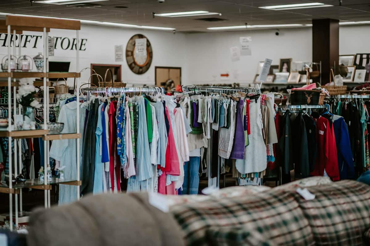 Racks of clothing inside The Gospel Mission Thrift Store